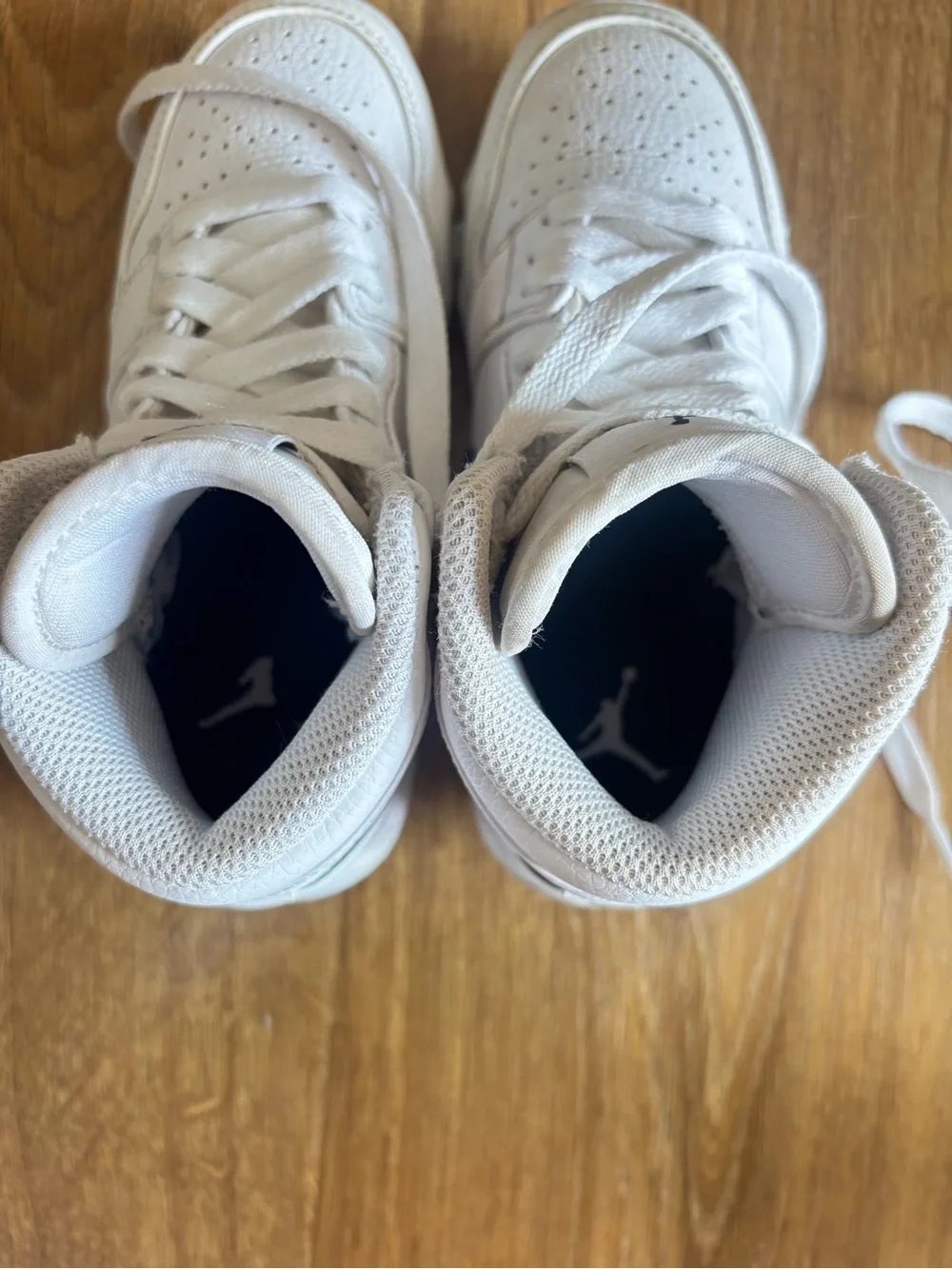 Nike White High-Top Jordan Sneakers with Black Jumpman